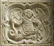 Panel 06:03 - Caped human-headed basilisk, holding its tail